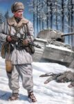 Finnish soldier armed with Suomi in front of a destroyed Kv-1 car.